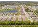 Aerial of a large neighborhood with ponds and roadways surrounded by trees and greenery at 1511 Lyonsdale Ln, Sanford, FL 32771