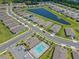 A community aerial showcases a pool, clubhouse, pond, and manicured lawns in a desirable neighborhood at 1511 Lyonsdale Ln, Sanford, FL 32771