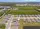 A high-angle view shows an expansive community with modern homes, green spaces, and access to natural surroundings at 1511 Lyonsdale Ln, Sanford, FL 32771