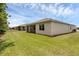 A well-maintained backyard features a screened-in patio and lush green grass, perfect for outdoor enjoyment at 1511 Lyonsdale Ln, Sanford, FL 32771