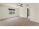 Well-lit bedroom with a ceiling fan and a window with a view at 1511 Lyonsdale Ln, Sanford, FL 32771