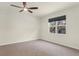 Bright bedroom features a ceiling fan and a window to let in natural light at 1511 Lyonsdale Ln, Sanford, FL 32771