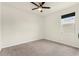 Carpeted bedroom with neutral walls and ceiling fan offering a blank canvas for customization at 1511 Lyonsdale Ln, Sanford, FL 32771