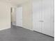 The bedroom features gray tile floor, closet and natural light at 1511 Lyonsdale Ln, Sanford, FL 32771