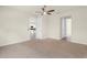 Spacious bedroom featuring neutral walls and carpeted flooring with access to kitchen at 1511 Lyonsdale Ln, Sanford, FL 32771