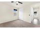 Carpeted bedroom with ceiling fan, walk-in closet and natural light at 1511 Lyonsdale Ln, Sanford, FL 32771