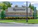 Landscaped community entrance sign for Rosecrest neighborhood with brick and stone accents and flowering plants at 1511 Lyonsdale Ln, Sanford, FL 32771