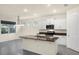 Bright kitchen with island, granite countertops, stainless steel appliances, and tile floors at 1511 Lyonsdale Ln, Sanford, FL 32771