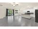 Open floor plan featuring kitchen island, white cabinets, and stainless steel appliances at 1511 Lyonsdale Ln, Sanford, FL 32771