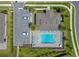 Aerial view of a community pool with lounge chairs, tables, parking and landscaped surroundings at 1511 Lyonsdale Ln, Sanford, FL 32771