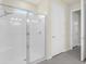 Bathroom featuring tiled shower with glass doors and a built-in seat at 1511 Lyonsdale Ln, Sanford, FL 32771