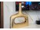 Modern gold vase with an open design, adding a decorative touch to the space at 16061 Blue Wave Way, Clermont, FL 34714