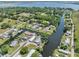 Captivating aerial view of waterfront properties along winding canals, leading to a picturesque lake at 5208 Oakdale Rd, Haines City, FL 33844