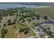 Extensive aerial view featuring residential properties near lush greenery and a beautiful lake landscape at 5208 Oakdale Rd, Haines City, FL 33844