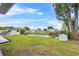 Waterfront yard with manicured lawn and canal access offering an ideal outdoor retreat at 5208 Oakdale Rd, Haines City, FL 33844