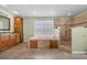 An elegant bathroom featuring a soaking tub, walk-in shower, dual sinks, and ample counter space at 5208 Oakdale Rd, Haines City, FL 33844