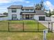 Charming two-story home with a well-maintained lawn and a welcoming front porch at 5208 Oakdale Rd, Haines City, FL 33844