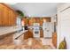 Functional kitchen featuring wooden cabinets, a clean design, and essential appliances for culinary adventures at 5208 Oakdale Rd, Haines City, FL 33844