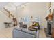 Spacious living room with high ceilings, a fireplace, and staircase, perfect for entertaining guests at 5208 Oakdale Rd, Haines City, FL 33844