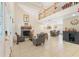 Open-concept living room featuring a fireplace, high ceilings, and smooth transition into the dining area at 5208 Oakdale Rd, Haines City, FL 33844