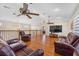 Large living area boasting vaulted ceilings, ceiling fans, and ample seating furniture at 5208 Oakdale Rd, Haines City, FL 33844