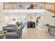 Bright living room with a high ceiling, staircase, and open floor plan seamlessly flowing into the kitchen at 5208 Oakdale Rd, Haines City, FL 33844