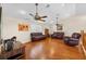 Inviting living room with wood floors, vaulted ceilings, ceiling fans, and natural light at 5208 Oakdale Rd, Haines City, FL 33844