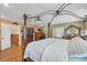 Large main bedroom features a four poster bed, en-suite bathroom, and ample space at 5208 Oakdale Rd, Haines City, FL 33844