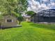 Sprawling backyard featuring a screen enclosed pool and a convenient storage shed at 1007 Gammage Pt, Oviedo, FL 32765