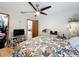 This bedroom features a ceiling fan, and decorative items for a unique space at 1007 Gammage Pt, Oviedo, FL 32765