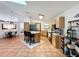 Kitchen island with seating and tile floors and modern appliances and cabinets at 1007 Gammage Pt, Oviedo, FL 32765