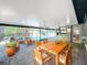 Large covered patio featuring a dining area, seating, and a view of the fenced pool at 1007 Gammage Pt, Oviedo, FL 32765