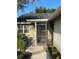 Inviting screened-in front porch, perfect for relaxing, and enjoying the view at 1034 Weathered Wood Cir, Winter Springs, FL 32708
