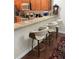 Eat-in kitchen featuring modern bar stool seating, countertops, and stainless steel appliances at 1034 Weathered Wood Cir, Winter Springs, FL 32708