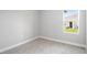 Cozy bedroom with plush carpeting and a bright window that illuminates the space at 12950 Sw 38Th Cir, Ocala, FL 34473