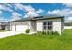 Manicured lawn and landscaping accentuates the side angle of this stylish single Gathering home at 12950 Sw 38Th Cir, Ocala, FL 34473