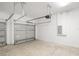 A well-lit garage with concrete floors, perfect for storage, parking, or a workshop at 12950 Sw 38Th Cir, Ocala, FL 34473