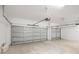 Spacious two-car garage with concrete floors and modern overhead door hardware at 12950 Sw 38Th Cir, Ocala, FL 34473