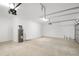 Large garage featuring concrete floors, a water heater, and ample space for vehicles at 12950 Sw 38Th Cir, Ocala, FL 34473