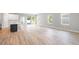 This living room has hardwood floors and lots of natural light at 12950 Sw 38Th Cir, Ocala, FL 34473