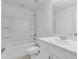 Clean bathroom featuring a shower-tub combo, white sink vanity and a large mirror at 172 River Front Way, Edgewater, FL 32141