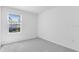 Serene bedroom with neutral walls, carpet and window bringing in natural light at 172 River Front Way, Edgewater, FL 32141