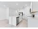 Kitchen featuring an island with a sink and stainless steel appliances at 172 River Front Way, Edgewater, FL 32141
