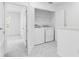 Upstairs laundry room with washer and dryer at 172 River Front Way, Edgewater, FL 32141