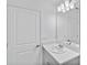 Bright bathroom with modern vanity, a large mirror, and ample counter space at 174 River Front Way, Edgewater, FL 32141
