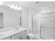 Bright bathroom with a double vanity and glass-enclosed shower at 174 River Front Way, Edgewater, FL 32141
