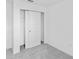 Bedroom featuring a closet with sliding doors and soft carpeting at 174 River Front Way, Edgewater, FL 32141