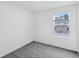 Carpeted bedroom featuring a window with neighborhood views at 174 River Front Way, Edgewater, FL 32141