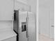 Stainless steel refrigerator and light gray cabinets in this kitchen at 174 River Front Way, Edgewater, FL 32141
