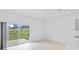 Open living room with sliding glass doors that open to the patio at 174 River Front Way, Edgewater, FL 32141